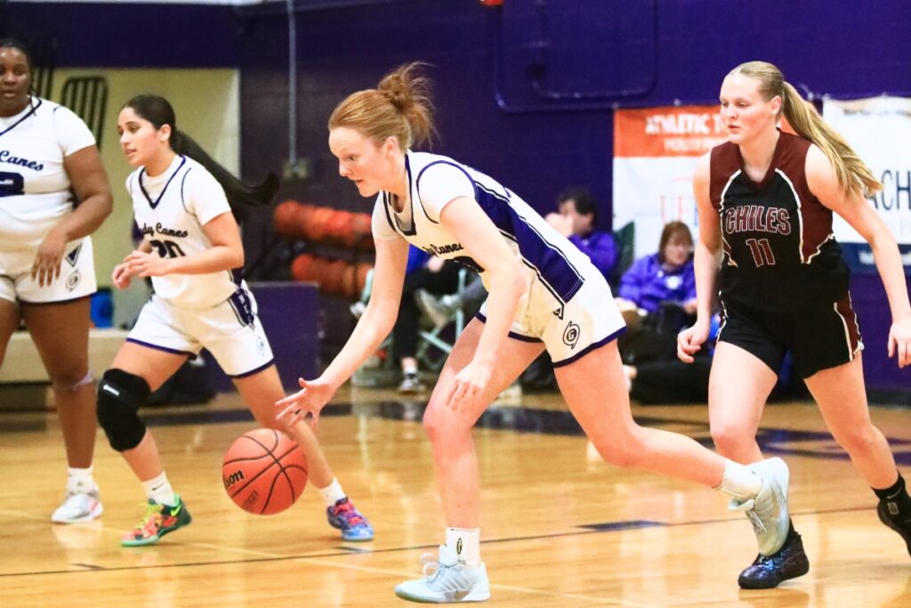 Gainesville's Sarah Collins (21) dribbles downcourt against Chiles (Tallahassee) in the Class 5A-District 2 Semifinals. Photo by C.J. Gish