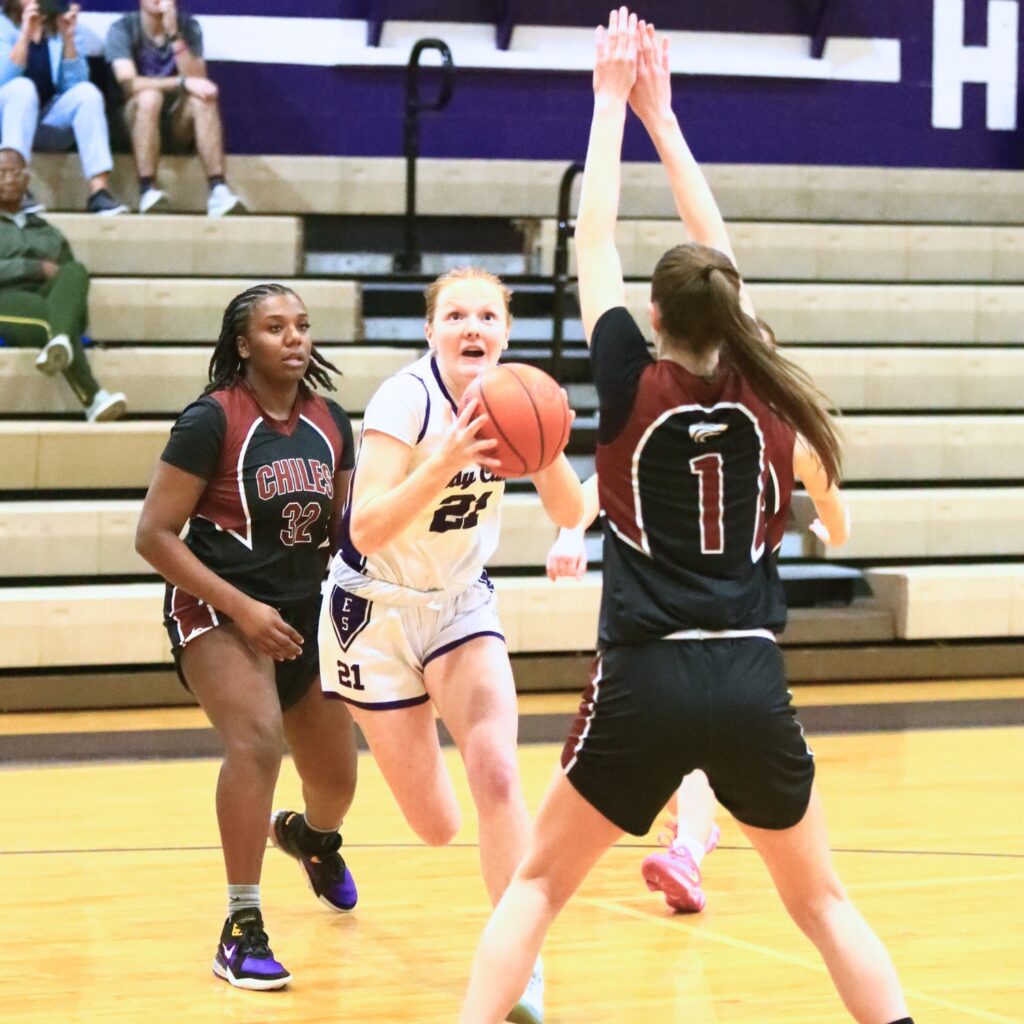 Gainesville's Sarah Collins (21) drives to the basket against Chiles (Tallahassee) in the Class 5A-District 2 Semifinals. Photo by C.J. Gish