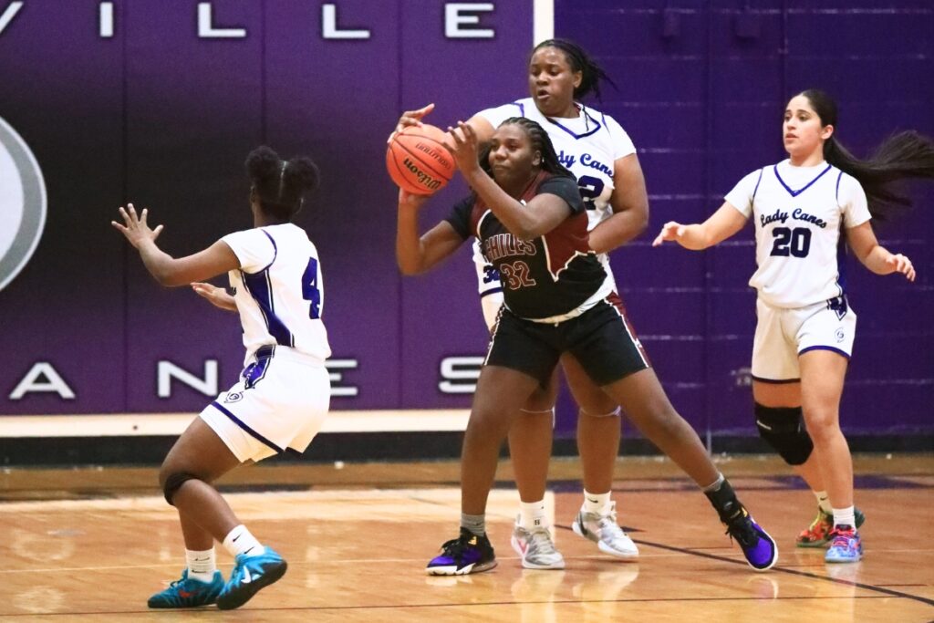 Gainesville's Takarii Jackson (32) gets a hand on the ball against Chiles (Tallahassee) in the Class 5A-District 2 Semifinals. Photo by C.J. Gish