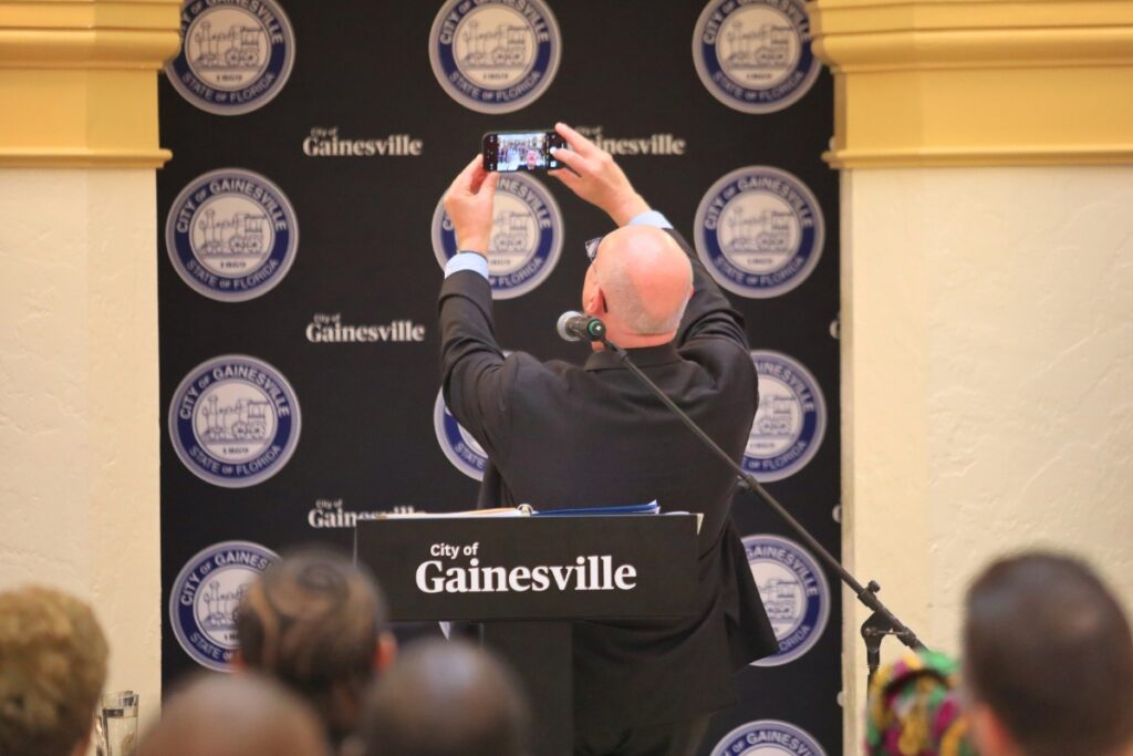 Mayor Harvey Ward takes a selfie at the start of the State of the City. Photo by Seth Johnson