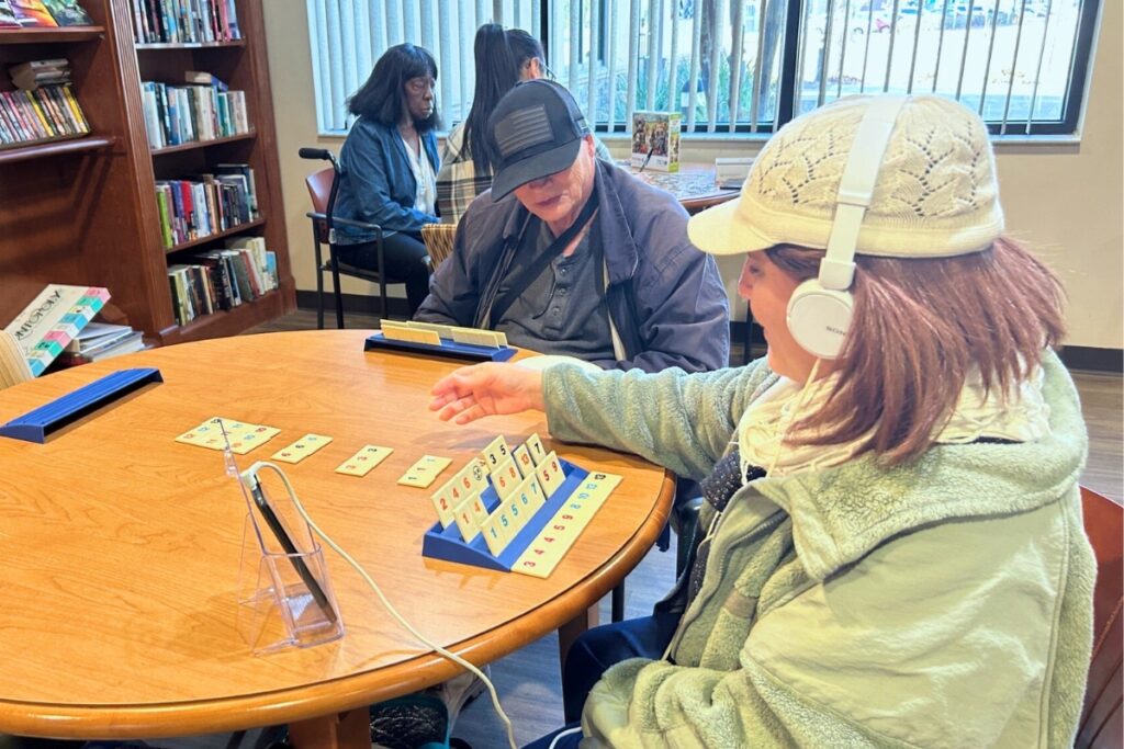 Millie Taylor, 59 and her husband, Russell Taylor, 71, in the game room at the senior center. Photo by Ronnie Lovler
