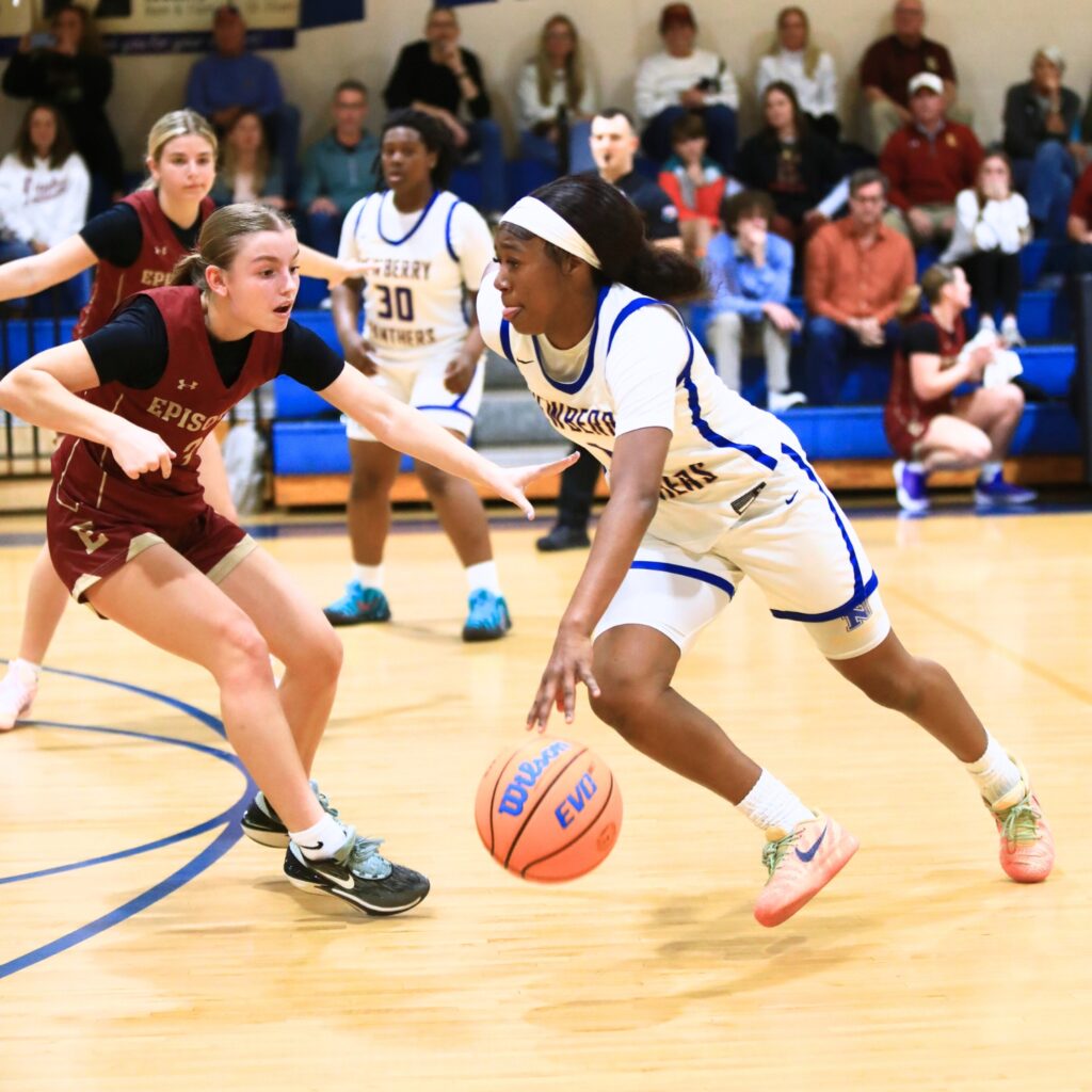 Newberry's Brandy Whitfield (1) drives the ball against Episcopal (Jacksonville) in the Class 3A-Region 1 Quarterfinals. Photo by C.J. Gish