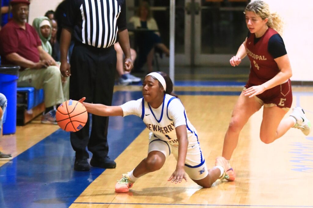 Newberry's Brandy Whitfield (1) tries to save the ball from going out of bounds against Episcopal (Jacksonville) in the Class 3A-Region 1 Quarterfinals. Photo by C.J. Gish