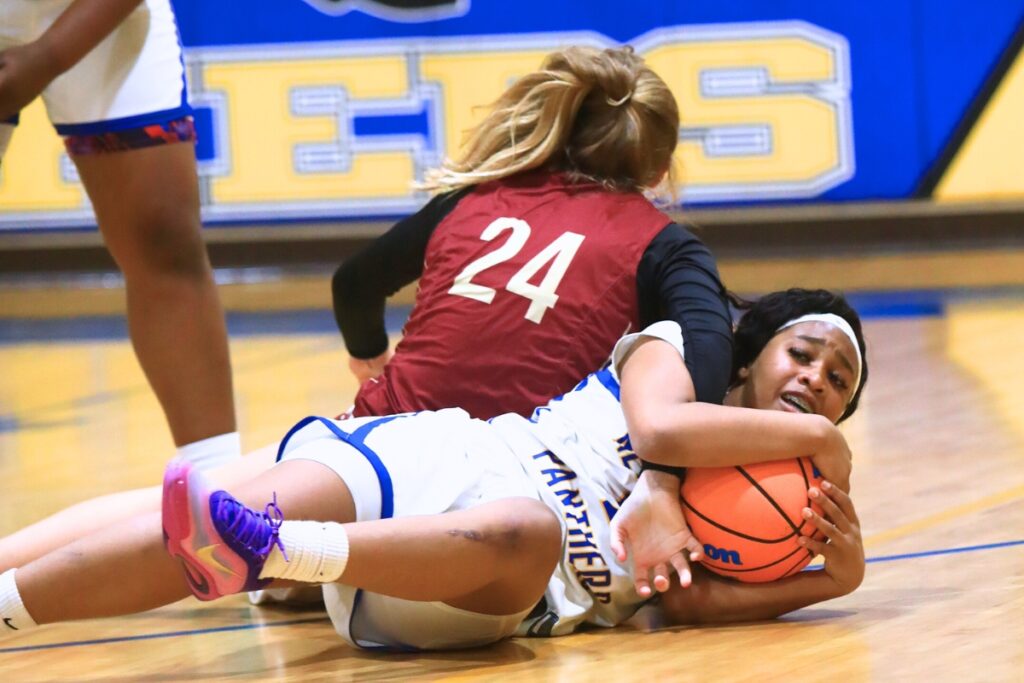Newberry's Londyn Hines (5) ties the ball up against Episcopal (Jacksonville) in the Class 3A-Region 1 Quarterfinals. Photo by C.J. Gish