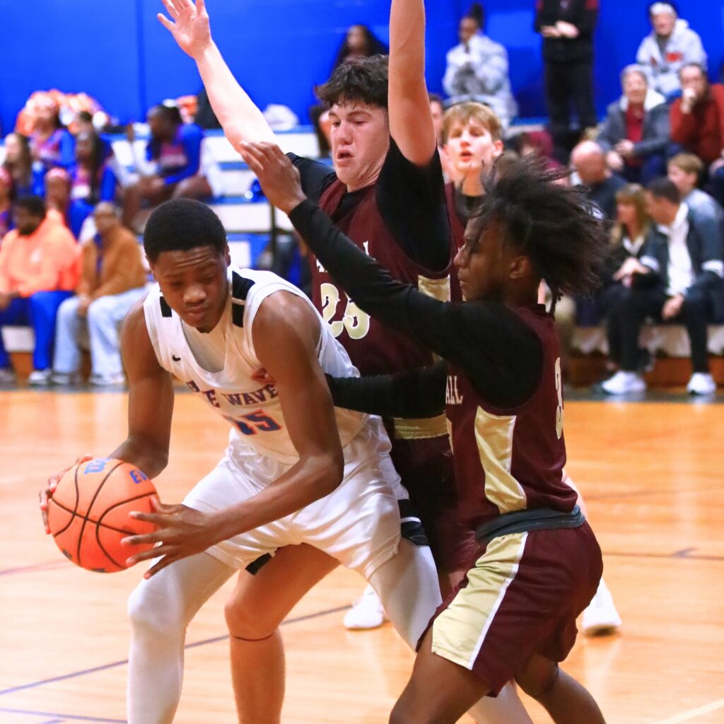 Oak Hall's Paul Thur de Koos (25) and Amari Ray (3) double team P.K. Yonge's Tray’Sean Jones (15) in the Class 2A-District 2 Semifinals. Photo by C.J. Gish