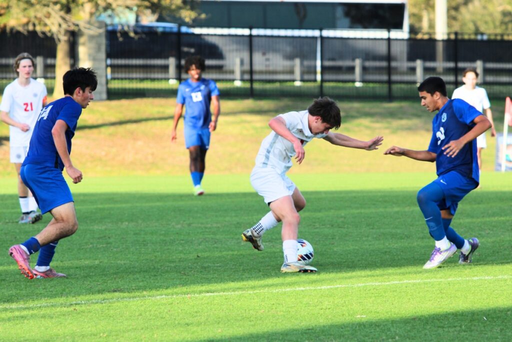 Owen Boone stays balanced and makes a move past the oncoming defender against Somerset Academy-Canyons (Boynton Beach) in the Class 3A state semifinals. Photo by Vinnie Cammarano