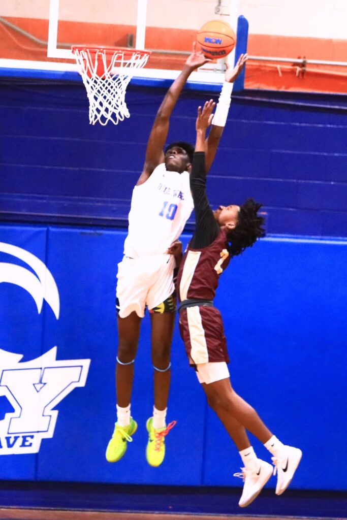 P.K. Yonge's Eugene Hall (10) puts up a shot against Oak Hall's Correy Brooks Jr. (2) in the Class 2A-District 2 Semifinals. Photo by C.J. Gish