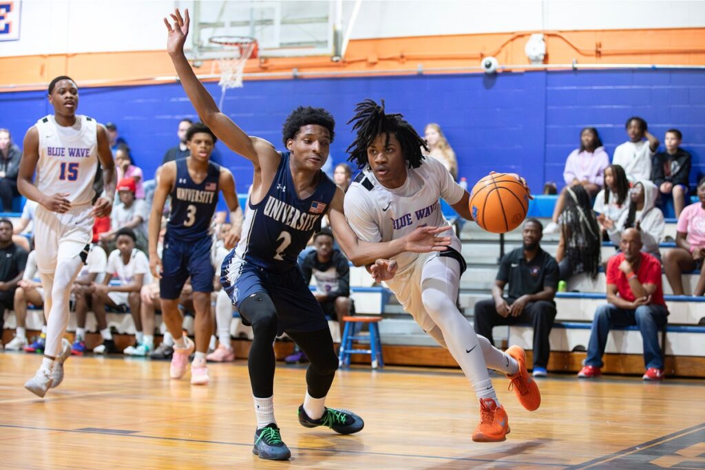 P.K. Yonge's Jarvis Cook Jr. (12) drives to the basket against University Christian (Jacksonville) in the Class 2A-Region 1 Quarterfinals. Photo by Megan V. Winslow