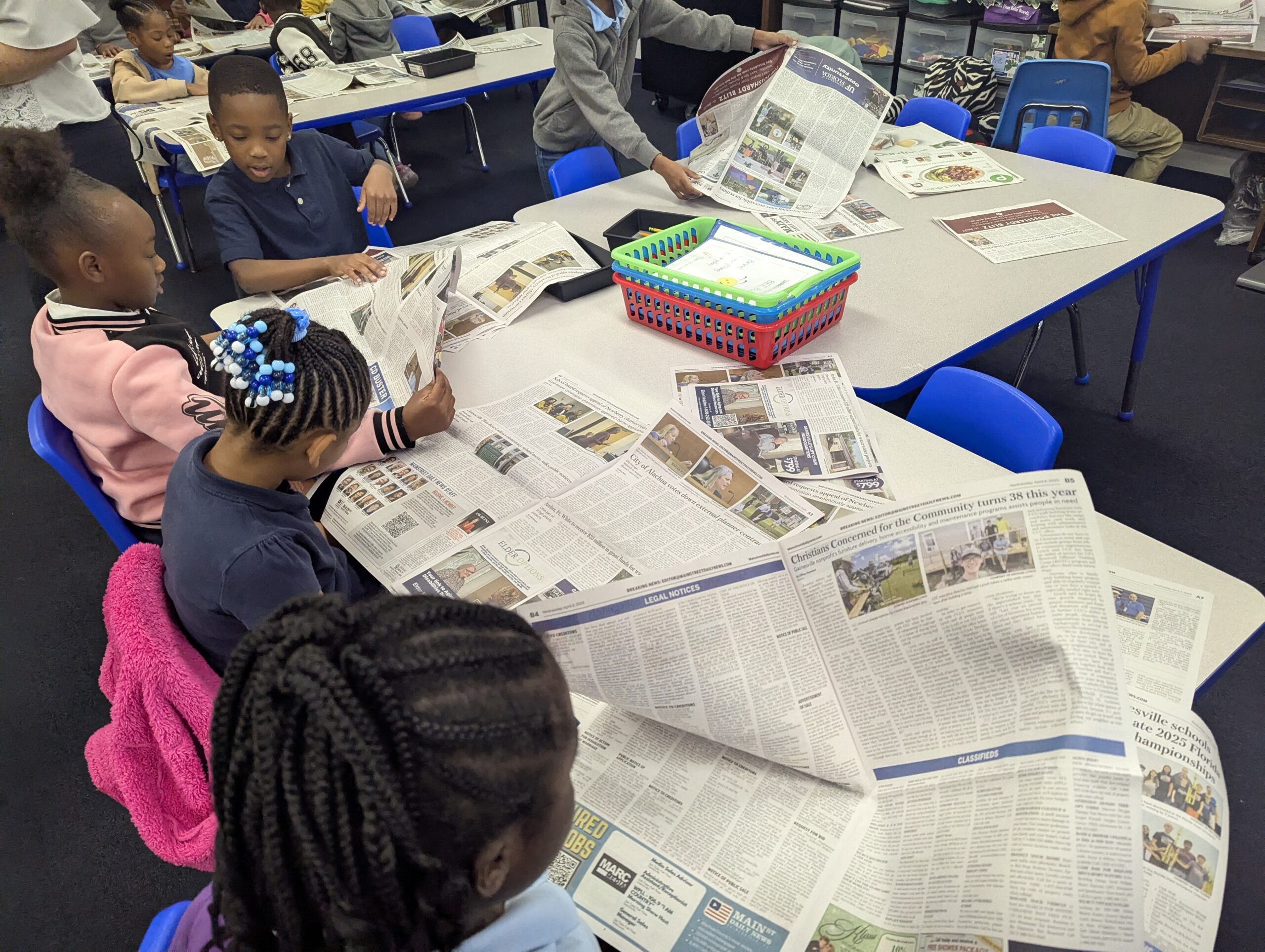Students reading newspapers
