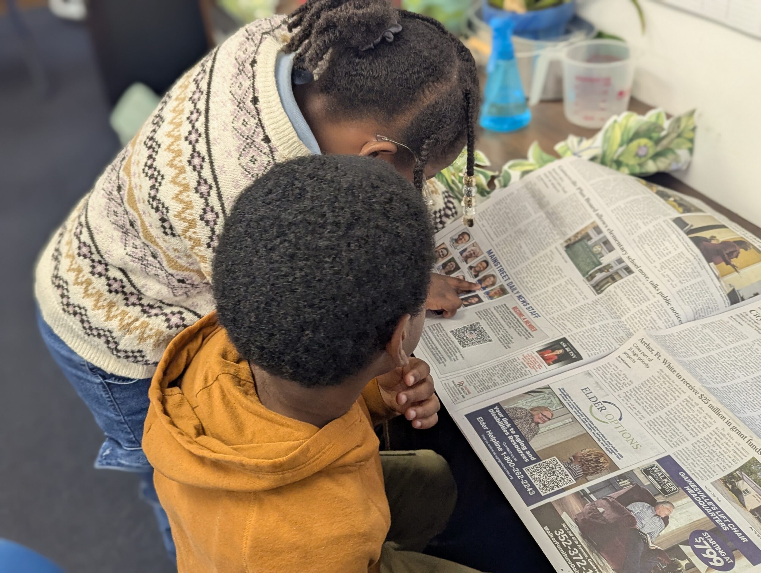 Students reading newspapers