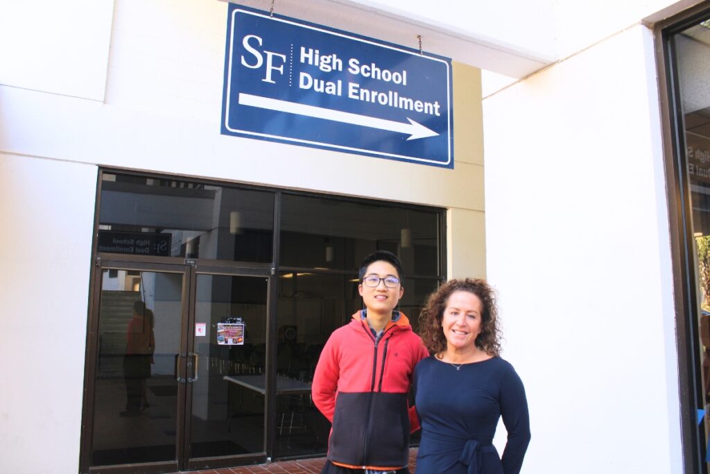 Robert Hu and Jen Homard pose for a photo outside the High School Dual Enrollment (HSDE) office at Santa Fe College's Northwest Campus. Photo by Nick Anschultz