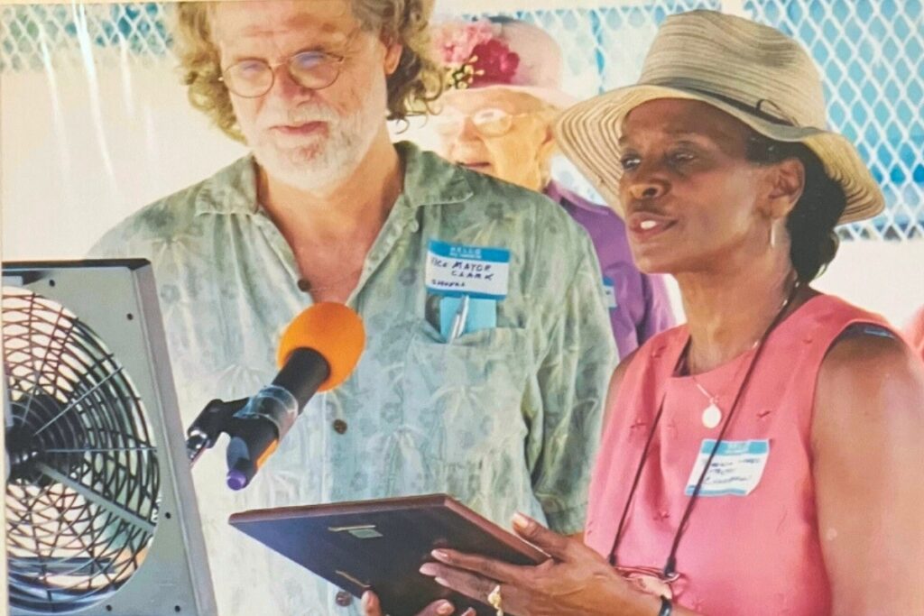 Roberta Lopez (right) speaks during the Archer Community Center's groundbreaking ceremony. Lopez helped raise almost $1 million to restore the abandoned Archer School gym during the project.