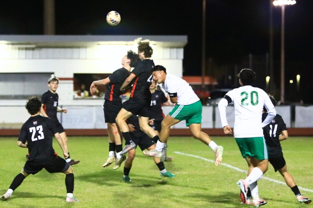 Santa Fe and Suwannee players battle for the ball in the Class 3A-Region 1 Quarterfinals. Photo by C.J. Gish