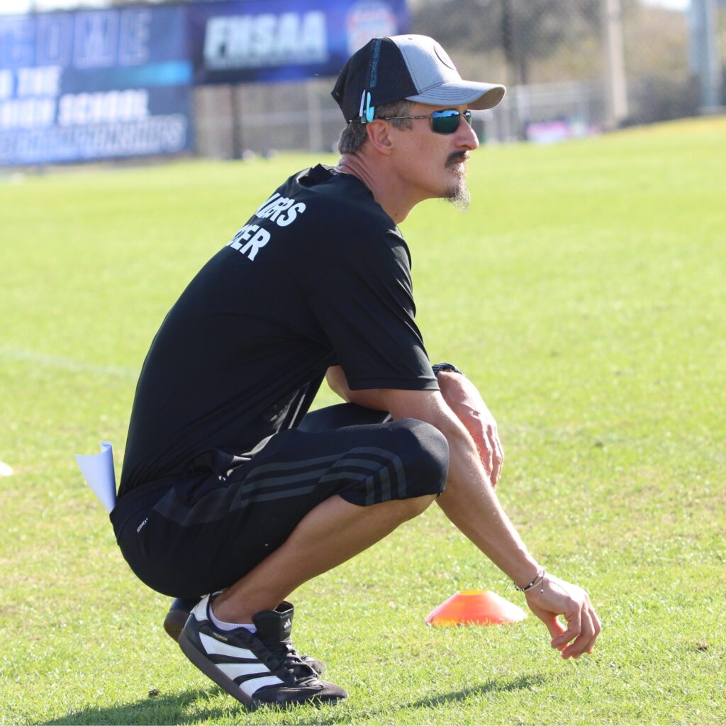 Santa Fe coach Morgan Dall'Acqua analyzing the field early in the first halfagainst Somerset Academy-Canyons (Boynton Beach) in the Class 3A state semifinals. Photo by Vinnie Cammarano