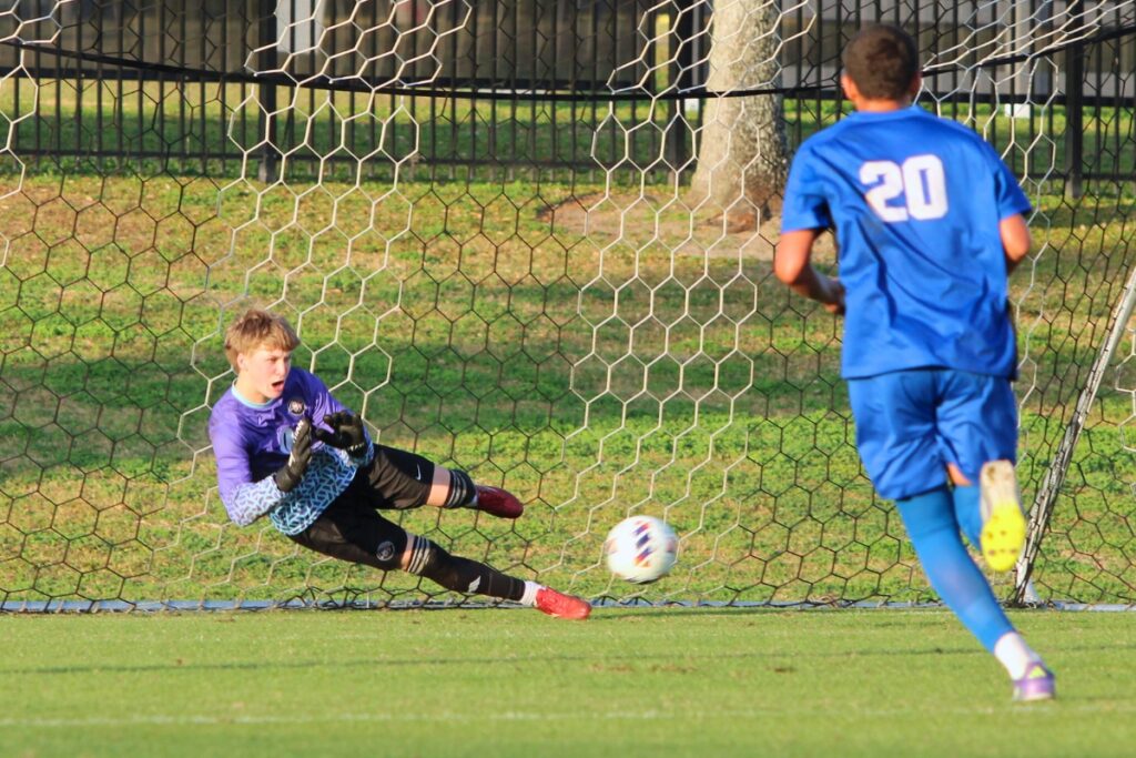 Santa Fe goalkeeper Hunter LaLonde attempts to save the penalty kick against Somerset Academy-Canyons (Boynton Beach) in the Class 3A state semifinals. Photo by Vinnie Cammarano