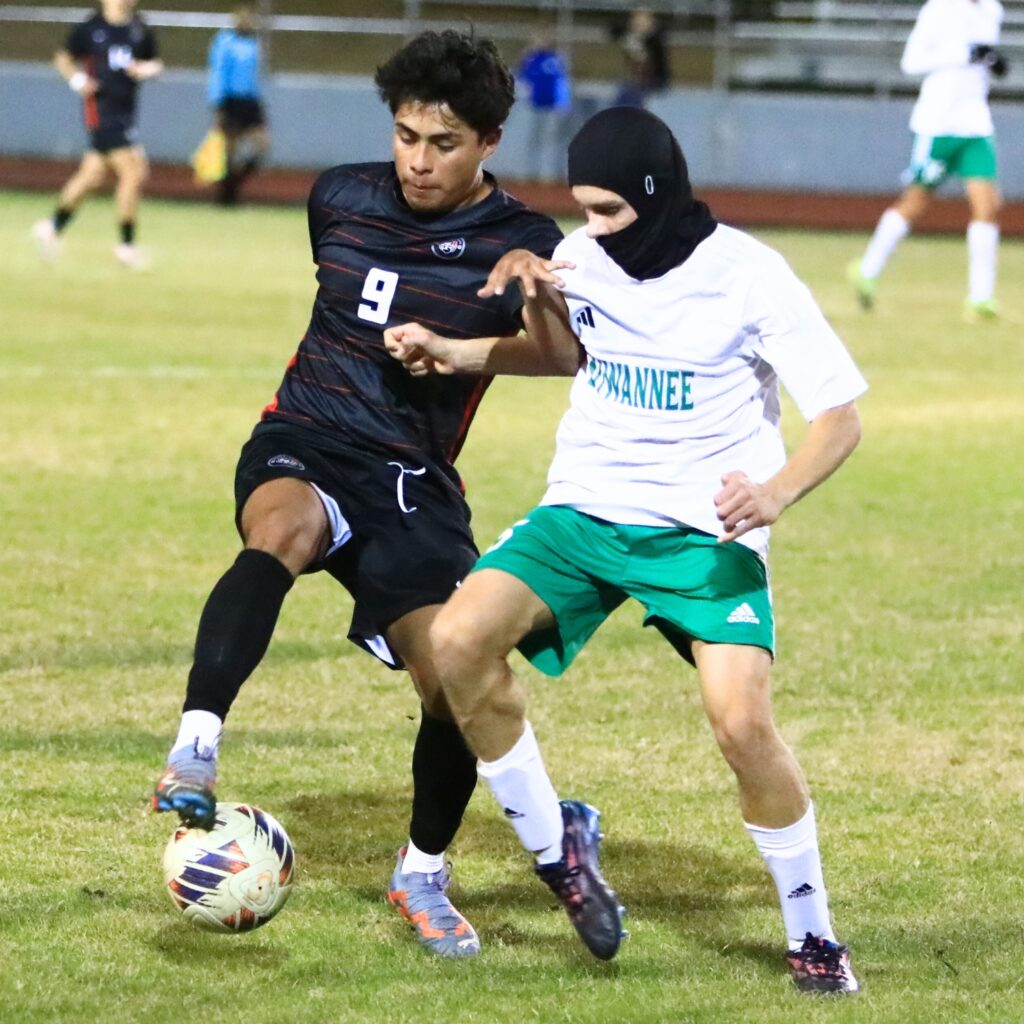 Santa Fe's Ever Garcia (5) and Suwannee's Andrew Hutcheson (5) battle for the ball in the Class 3A-Region 1 Quarterfinals. Photo by C.J. Gish