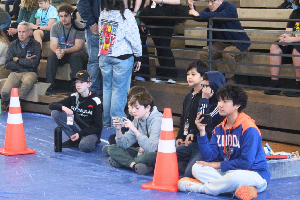 Spectators watch a middle school challenge on Thursday. Photo by Nick Anschultz