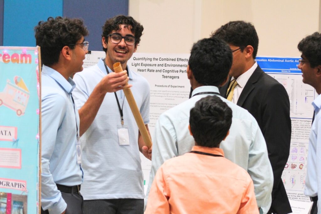 Students engage in conversation in between judging. Photo by Nick Anschultz
