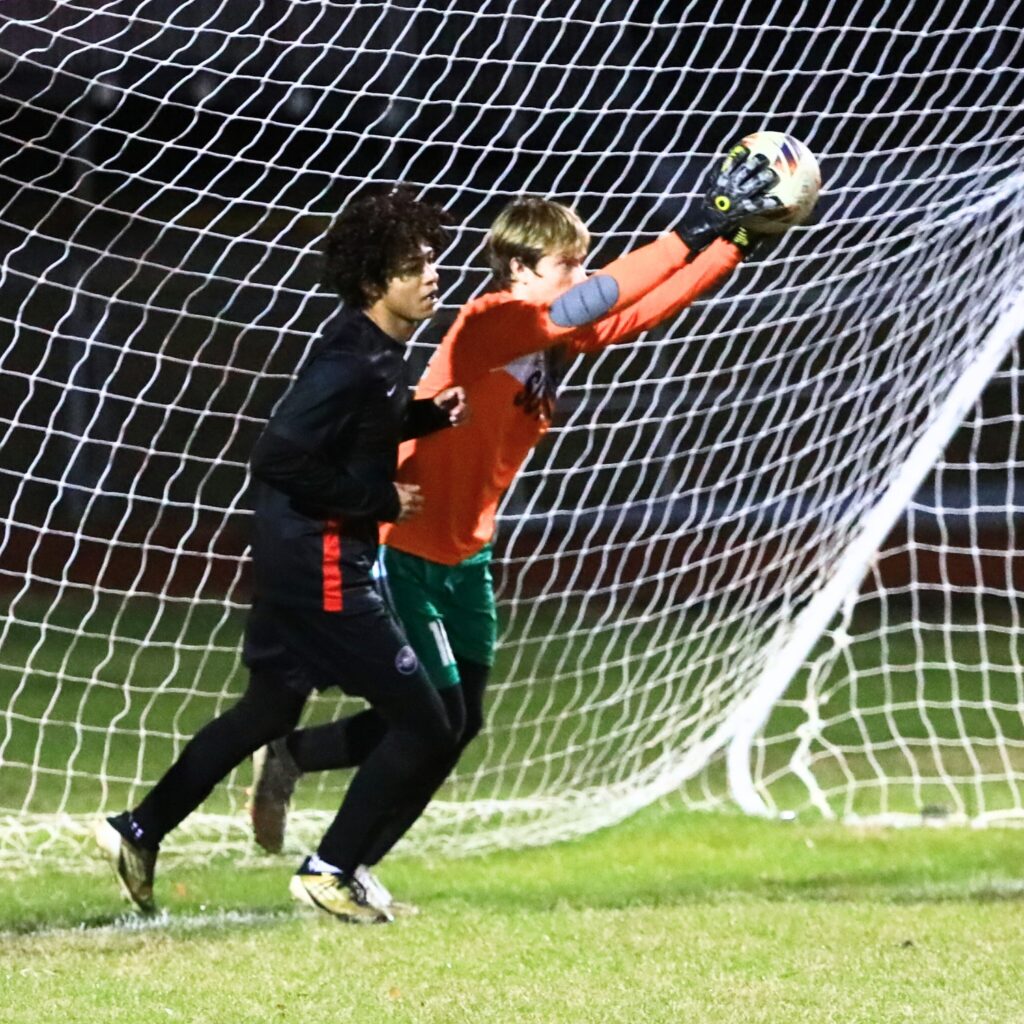 Suwannee goalkeeper Brayden Hearn with a save against Santa Fe in the Class 3A-Region 1 Quarterfinals. Photo by C.J. Gish