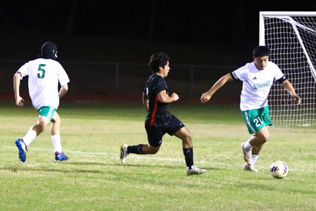 Suwannee's Josue Tellez (21) clears the ball away against Santa Fe in the Class 3A-Region 1 Quarterfinals. Photo by C.J. Gish