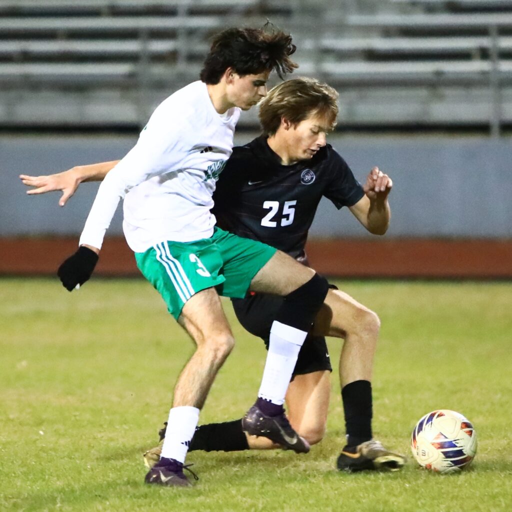 Suwannee's Rember Alonso (3) and Santa Fe's Murli Kopecky (25) go after the ball in the Class 3A-Region 1 Quarterfinals. Photo by C.J. Gish