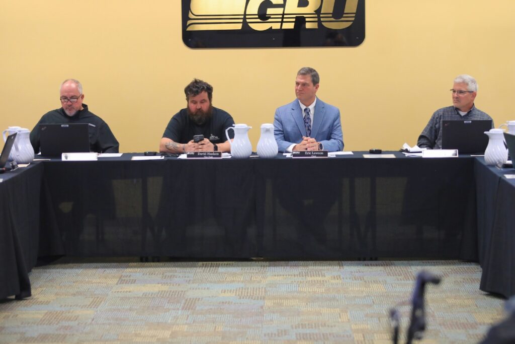 The GRU Authority directors listen to a presentation in January 2026. From left, directors Jack Jacobs, David Haslam, Eric Lawson and Chip Skinner.