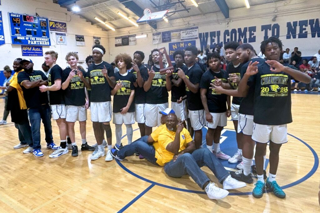 The Newberry boys basketball team captured its first back-to-back district championship in program history on Saturday. Photo by Marty Pallman