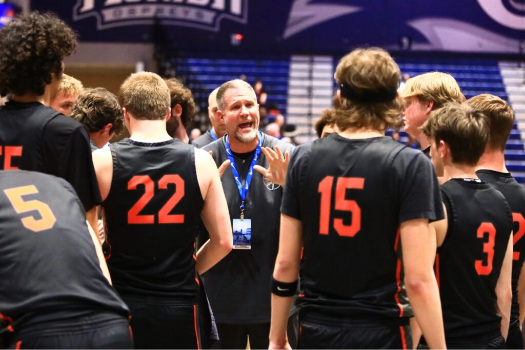 Trenton coach Eric Bullis talks to his team during a timeout against Williston in the Rural state semifinals. Photo by C.J. Gish