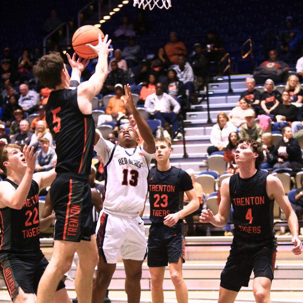 Trenton's Mason VunCannon (5) and Williston's Todd Brown (13) go for a rebound in the Rural state semifinals. Photo by C.J. Gish