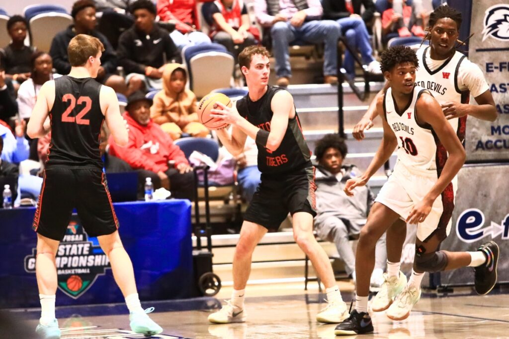 Trenton's Mason VunCannon (5) looks downcourt for a pass against Williston in the Rural state semifinals. Photo by C.J. Gish