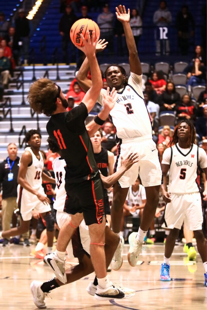 Trenton's Nathan Ridgell (11) puts up a shot against Williston's Jaden Magee (2) in the Rural state semifinals. Photo by C.J. Gish
