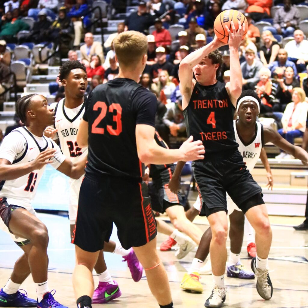 Trenton's Noah Owens (4) looks to pass against Williston in the Rural state semifinals. Photo by C.J. Gish