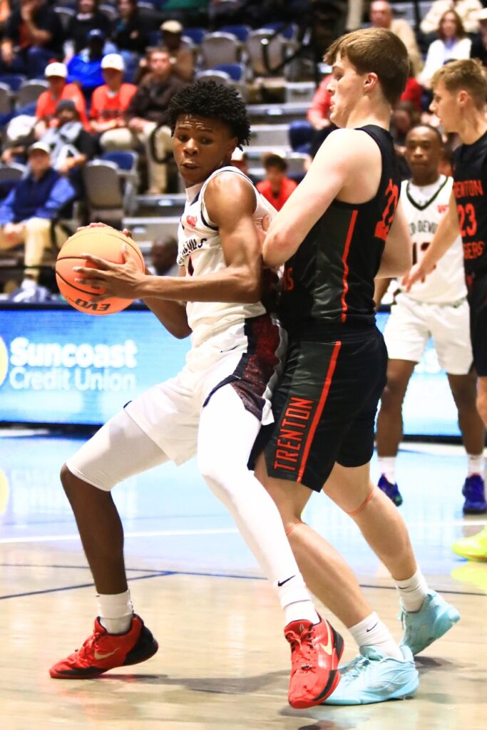 Trenton's Tyler Bullis (22) defends Williston's Marcus Appling (1) in the Rural state semifinals. Photo by C.J. Gish