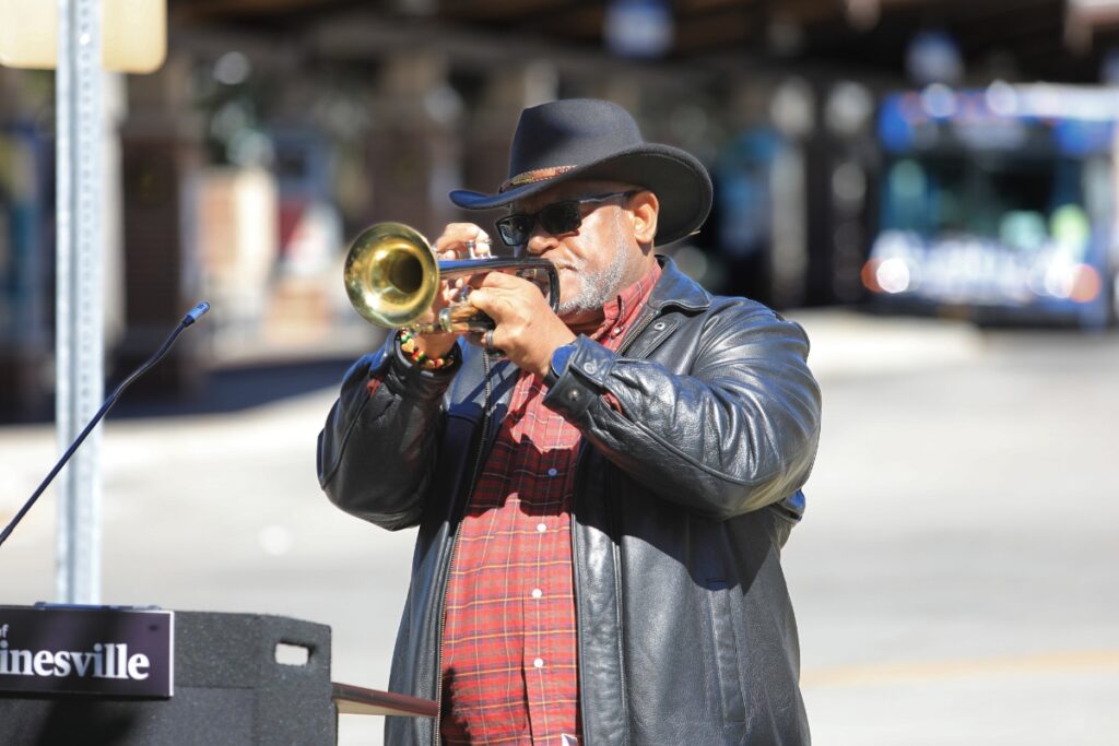 Hartley Leacock Jr. plays "What a Wonderful World" on trumpet during Monday's Rosa Parks and Claudette Colvin event.