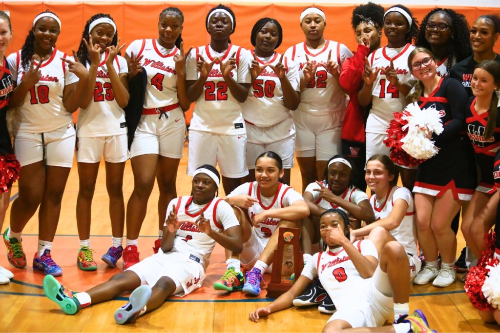 Williston celebrates its Rural Class District 7 championship game win over Wildwood. Photo by C.J. Gish