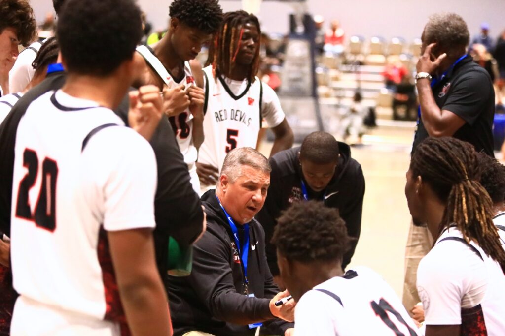 Williston coach Jim Ervin talks to his team during a timeout against Trenton in the Rural state semifinals. Photo by C.J. Gish