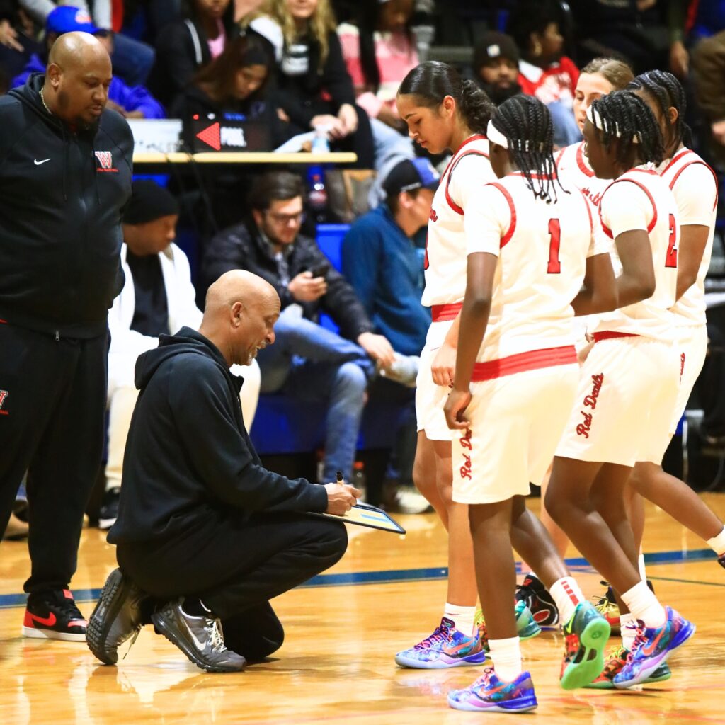 Williston coach Willie Powers draws up a play during a timeout against Wildwood in the Rural Class District 7 championship game. Photo by C.J. Gish