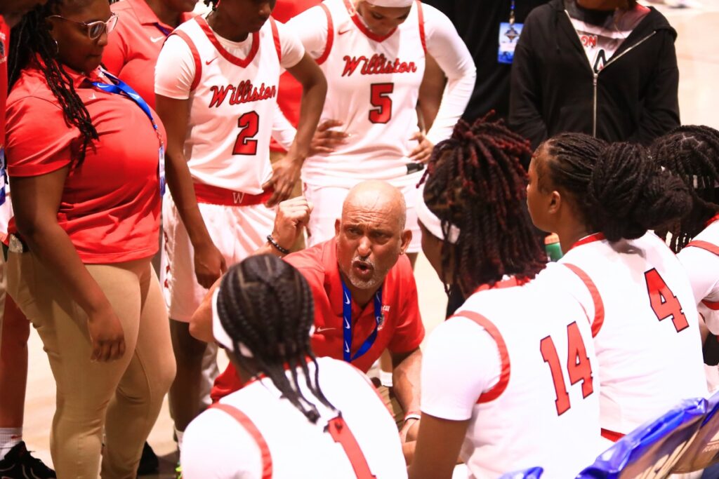 Williston coach Willie Powers talks to his team during a timeout against Blountstown in the Rural state semifinals. Photo by C.J. Gish