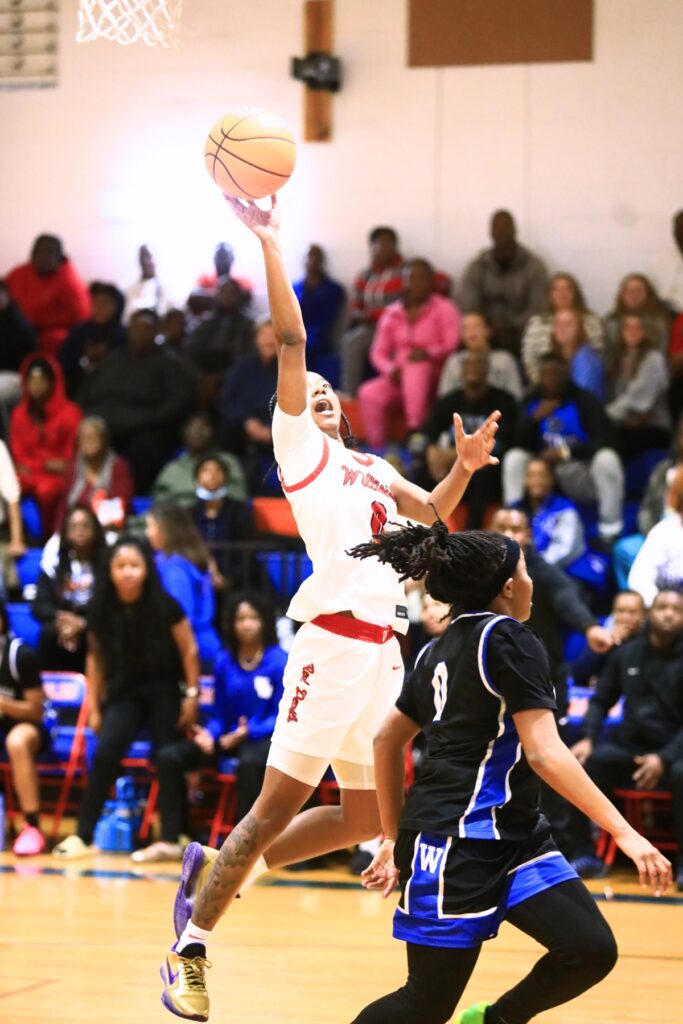 Williston's Ashlyn Young (0) puts up a shot against Wildwood in the Rural Class District 7 championship game. Photo by C.J. Gish