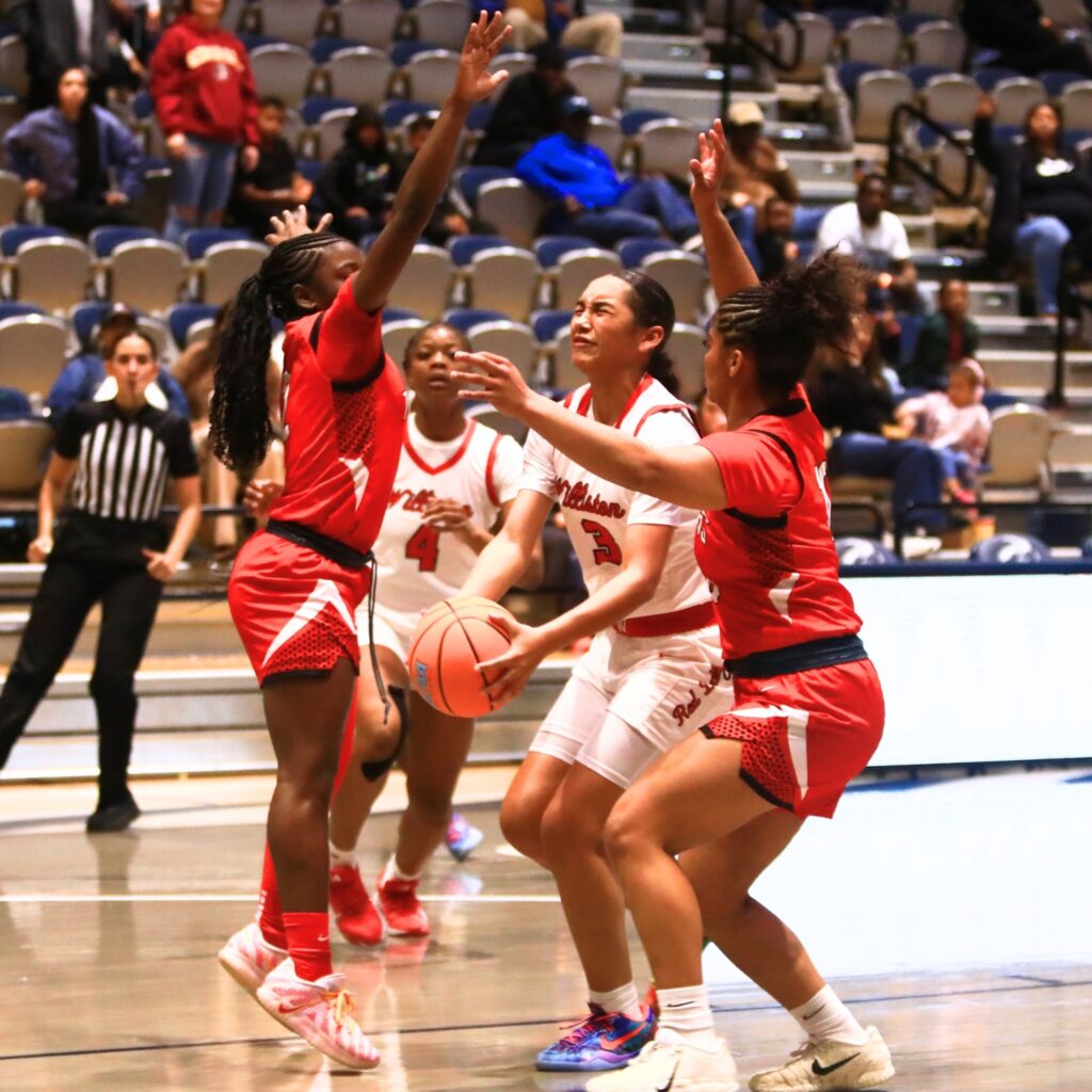 Williston's Delecia Dallas (3) drives to the basket for the go-ahead score against Blountstown in the Rural state semifinals. Photo by C.J. Gish