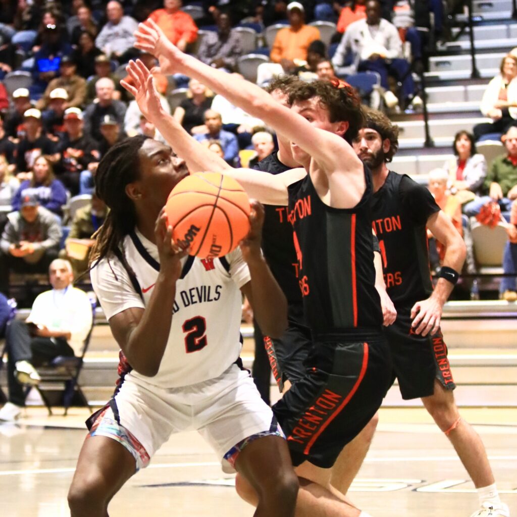 Williston's Jaden Magee (2) prepares for a shot against Trenton's Noah Owens (4) in the Rural state semifinals. Photo by C.J. Gish