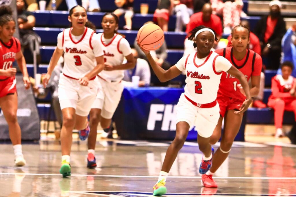 Williston's Trinity Solomon (2) with a pass downcourt against Blountstown in the Rural state semifinals. Photo by C.J. Gish
