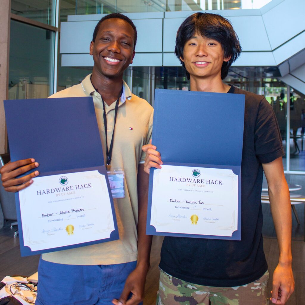 Alutte Stephen (left), Yuxuan Tao and Alina Vasina (not pictured) placed first in the hardware hackathon. Courtesy of UF AACE
