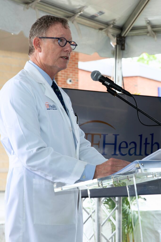 Dr. C. Parker Gibbs, chair of the UF Health Department of Orthopaedic Surgery and Sports Medicine, delivers remarks before a ribbon cutting ceremony outside the new UF Health Orthopaedic Surgical Center. Photo by Megan V. Winslow