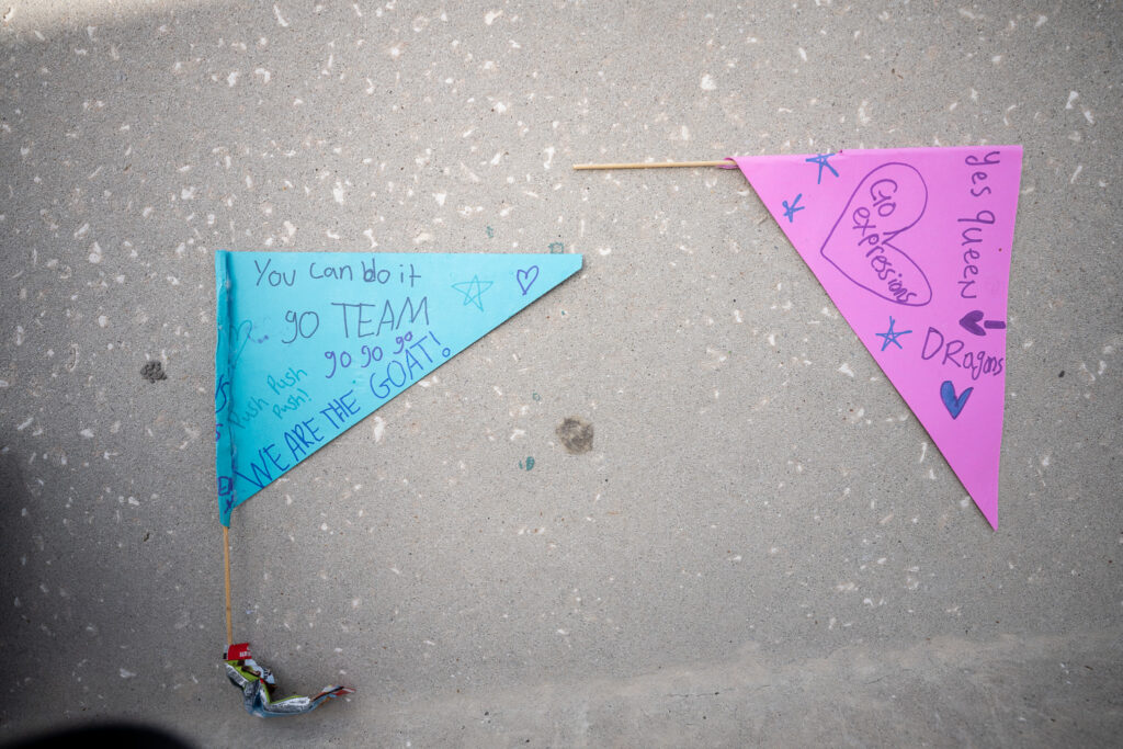 Flags with supportive messages left in the stands.