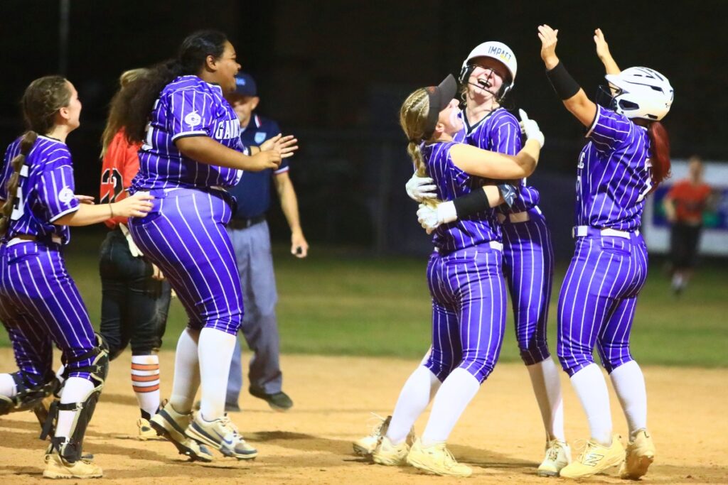 Gainesville players celebrate after Leanna Bourdage drives in the winning run in the bottom of the ninth inning for a 1-0 victoy over visiting Trenton. Photo by C.J. Gish