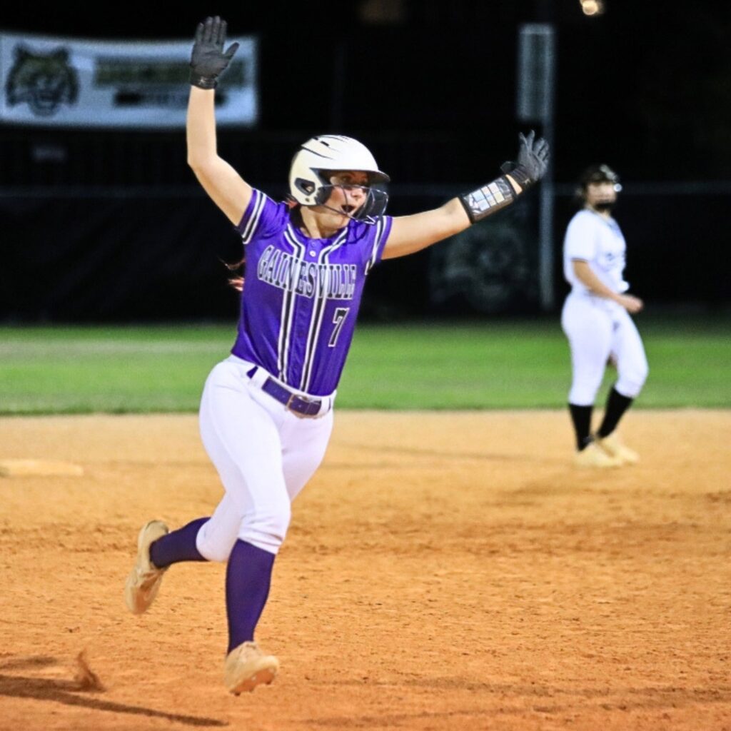 Gainesville's Aubree Suarez celebrates as she rounds third base following an over-the-fence home run against Buchholz. Photo by Seth Johnson