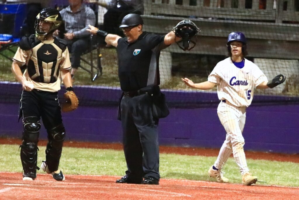 Gainesville's Kaiden Griffith (15) scores in the bottom of the fifth to bring the Hurricanes within 3-2 against Buchholz. Photo by C.J. Gish