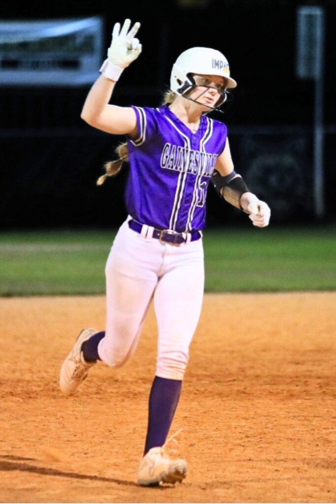Gainesville's Leanna Bourdage celebrates an over-the-fence home run against Buchholz. Photo by Seth Johnson