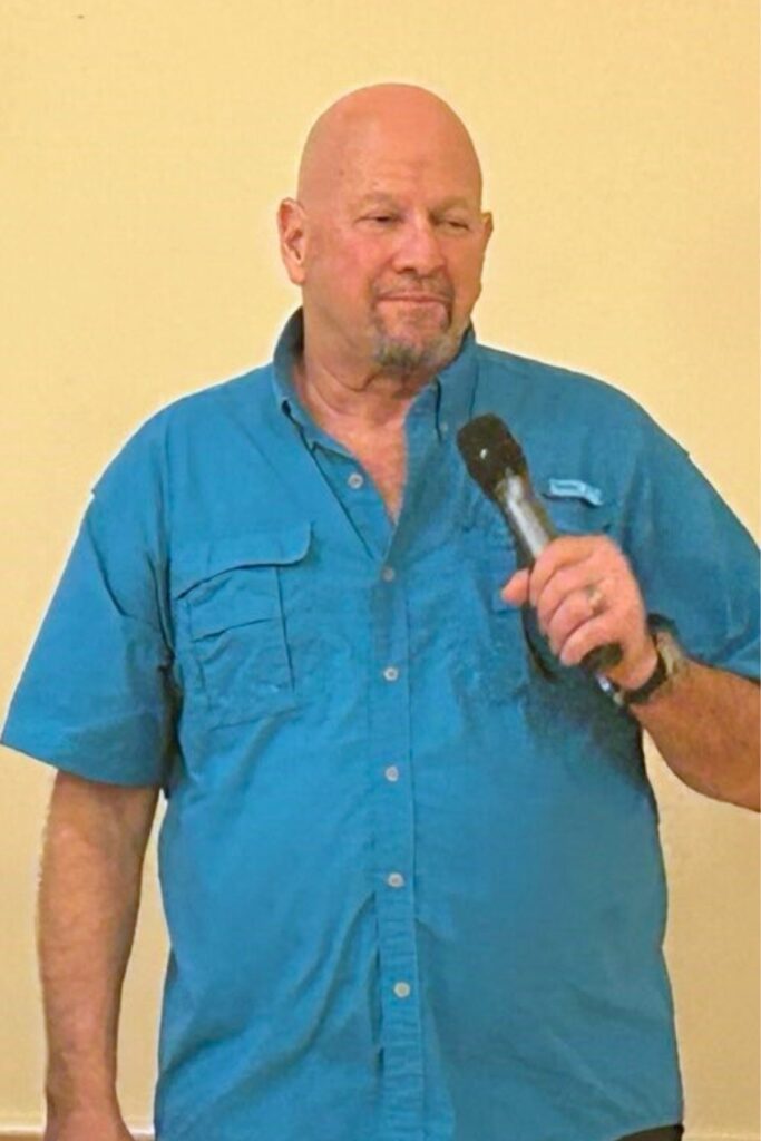 Gene Sanders calls out song selections during the Altrusa House's Music Bingo Trivia fundraiser on Friday. Photo by Ronnie Lovler